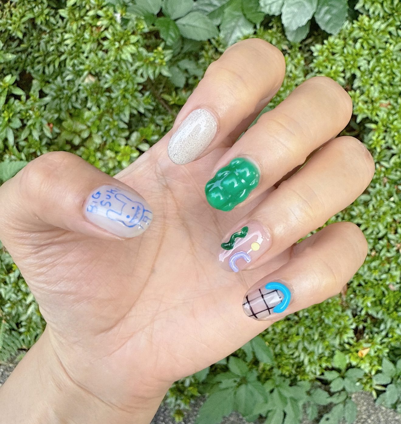 An artful hand-painted Tokyo nail set with playful motifs
