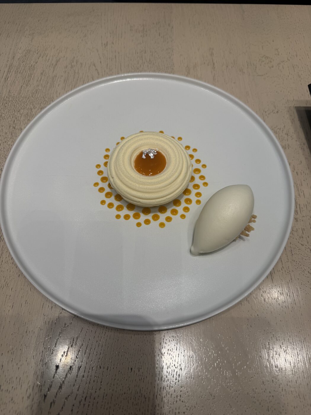 A plated cream-cheese mousse with a quenelle of rosemary ice cream at the Artizon café